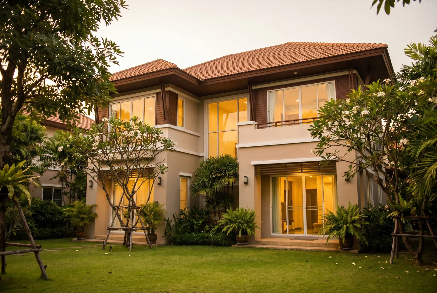 Case A — บ้านครอบครัวย่านบางนา · Thai suburban family home exterior at golden hour
